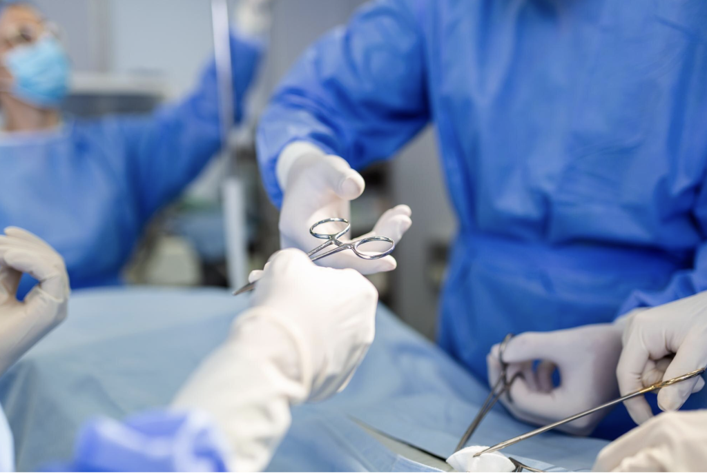 surgeons operating on a person in a surgery room